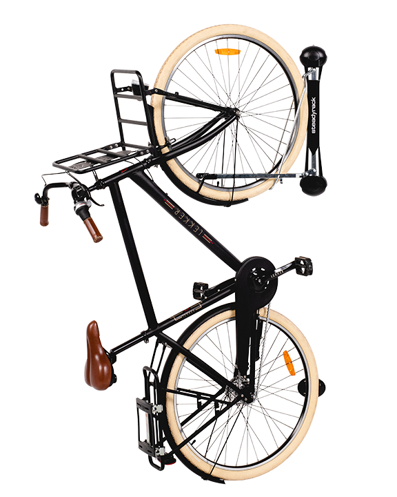 A black bike with fenders hanging vertically on a Steadyrack fender rack.